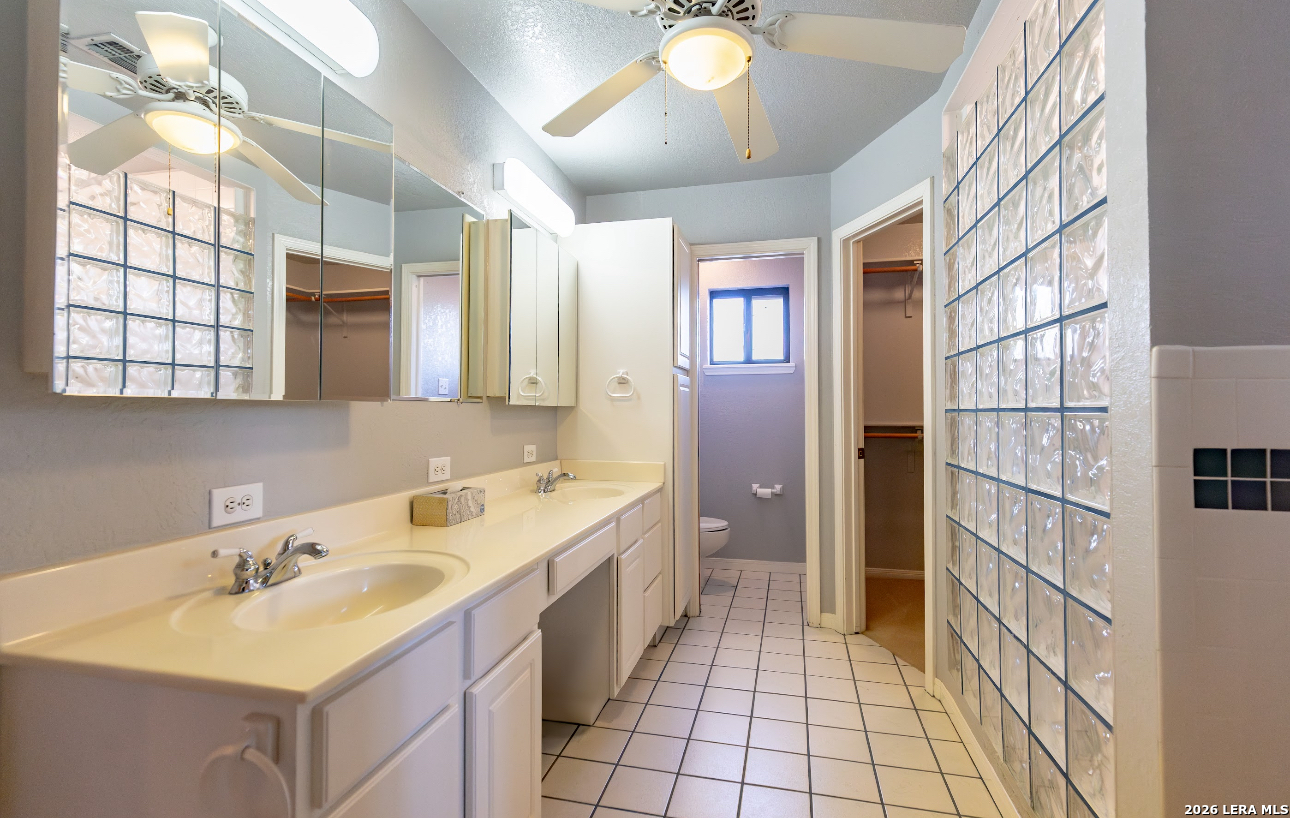 375 Bluntzer Road Jourdanton, TX 78026 - Photo 29 of 44 a bathroom with a sink and a mirror