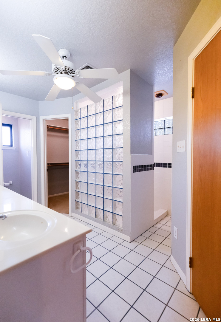 375 Bluntzer Road Jourdanton, TX 78026 - Photo 30 of 44 a view of a hallway with closet and chandelier fan