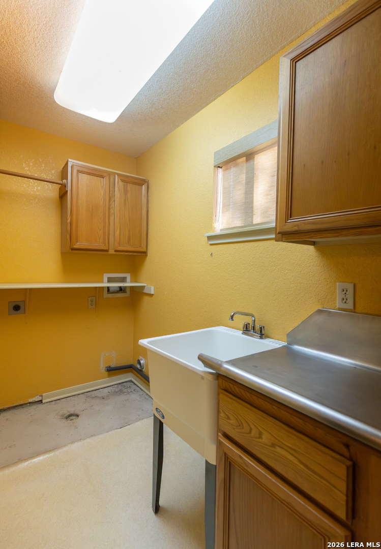 375 Bluntzer Road Jourdanton, TX 78026 - Photo 38 of 44 a view of a room with storage and utility