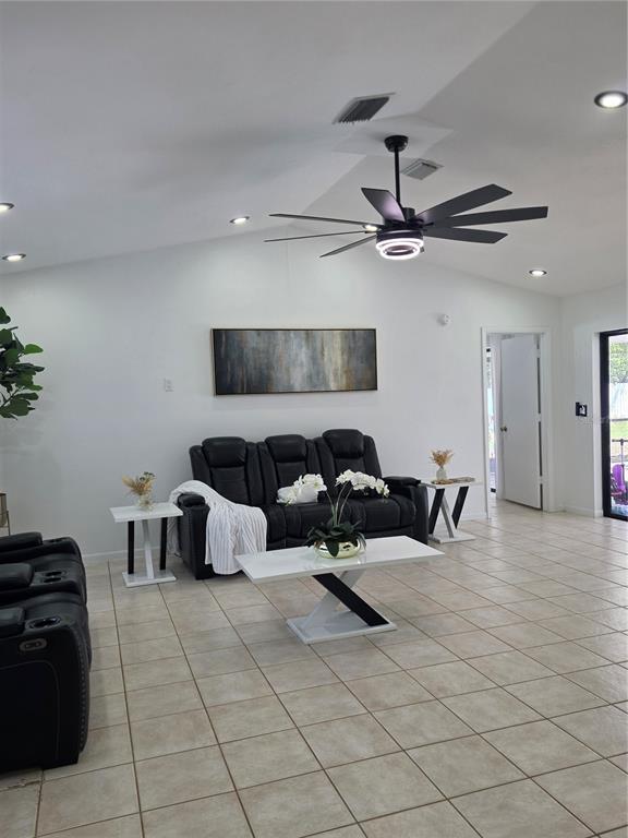 13128 Hazelcrest Street Spring Hill, FL 34609 - Photo 12 of 46 a bedroom with furniture and a ceiling fan