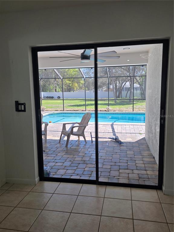 13128 Hazelcrest Street Spring Hill, FL 34609 - Photo 13 of 46 a view of outdoor space with swimming pool