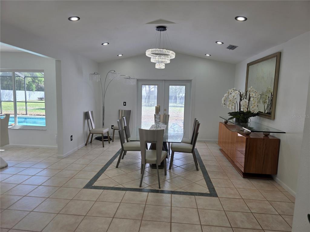 13128 Hazelcrest Street Spring Hill, FL 34609 - Photo 15 of 46 a view of a dining room with furniture