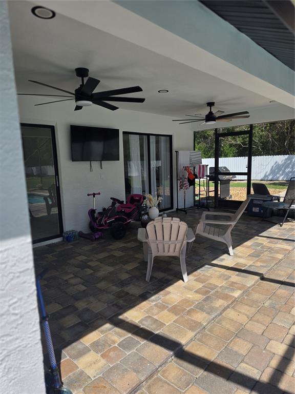 13128 Hazelcrest Street Spring Hill, FL 34609 - Photo 30 of 46 a view of a porch with furniture