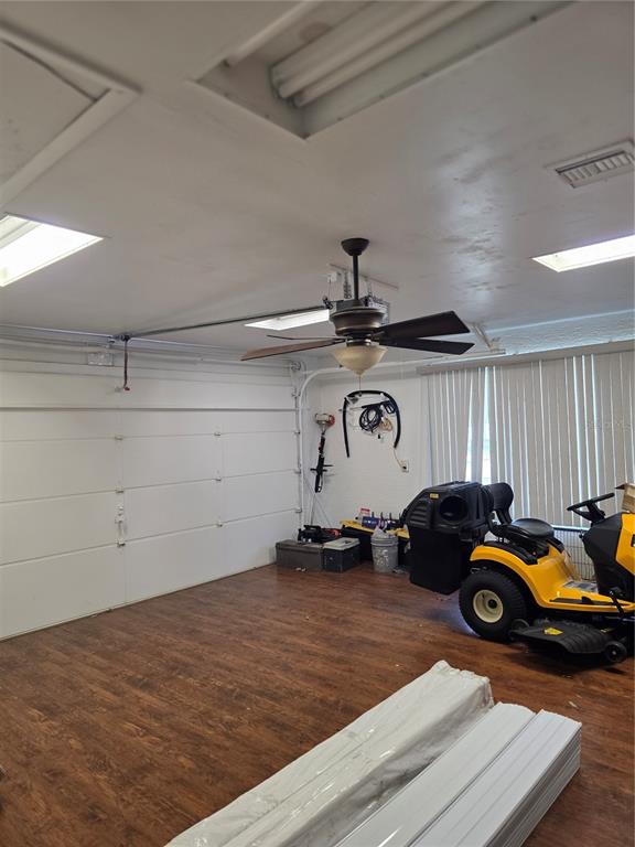 13128 Hazelcrest Street Spring Hill, FL 34609 - Photo 33 of 46 a car parked in a garage