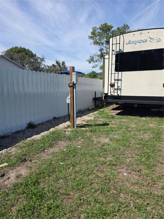 13128 Hazelcrest Street Spring Hill, FL 34609 - Photo 36 of 46 a view of a back yard