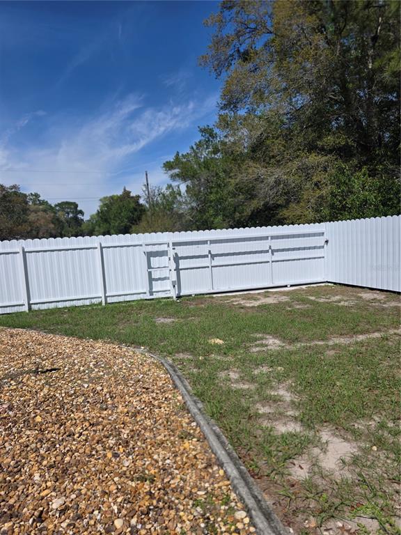 13128 Hazelcrest Street Spring Hill, FL 34609 - Photo 40 of 46 a view of a backyard