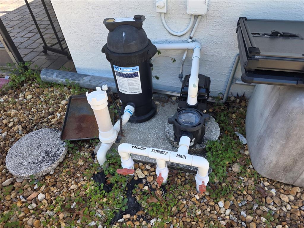 13128 Hazelcrest Street Spring Hill, FL 34609 - Photo 42 of 46 a living room with furniture and a rug