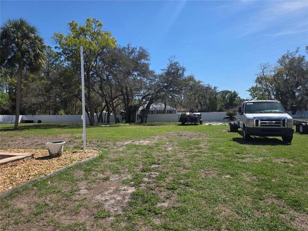 13128 Hazelcrest Street Spring Hill, FL 34609 - Photo 43 of 46 a view of a park with large trees