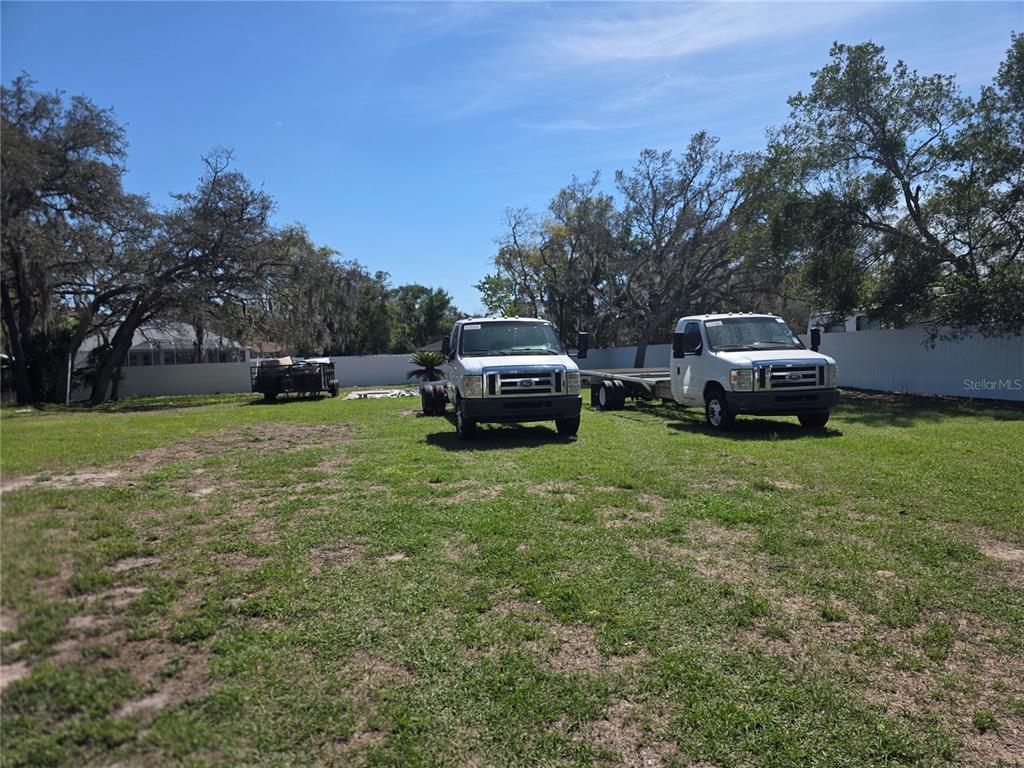 13128 Hazelcrest Street Spring Hill, FL 34609 - Photo 44 of 46 a front view of a house with a yard