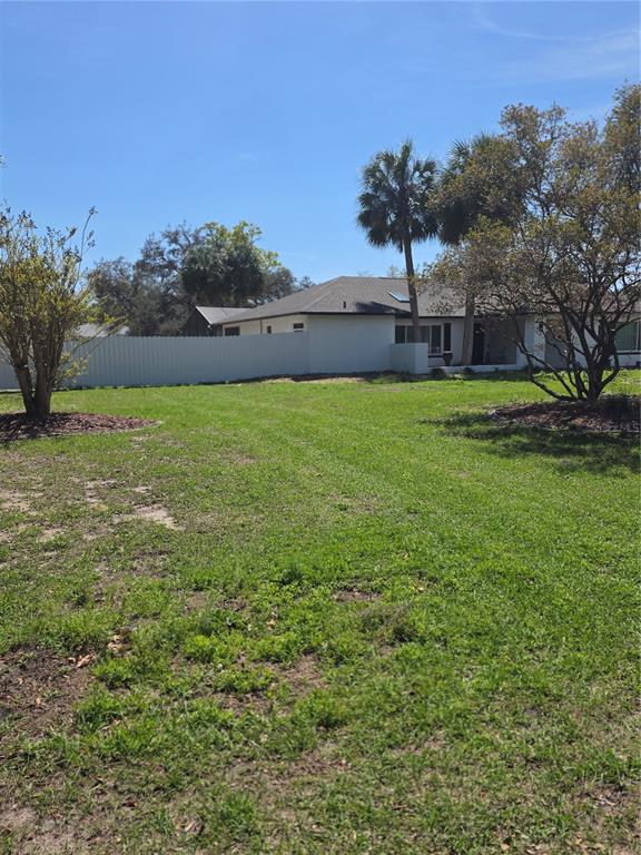 13128 Hazelcrest Street Spring Hill, FL 34609 - Photo 5 of 46 a view of a garden