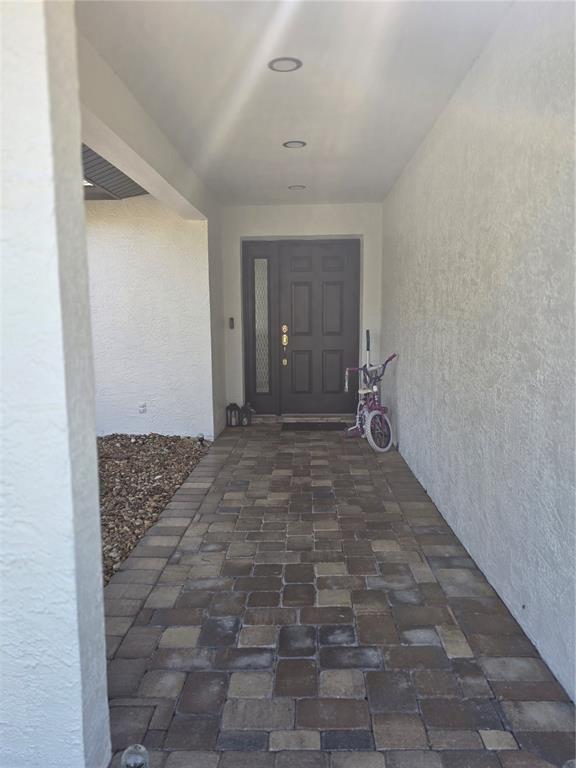 13128 Hazelcrest Street Spring Hill, FL 34609 - Photo 8 of 46 a bathroom with a sink and a mirror
