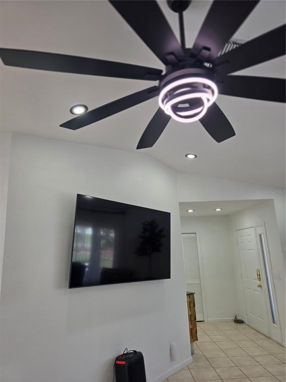 13128 Hazelcrest Street Spring Hill, FL 34609 - Photo 10 of 46 a living room with furniture and a flat screen tv