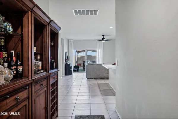 a hallway with a view of living room