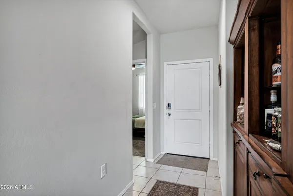 a view of a hallway with a living room