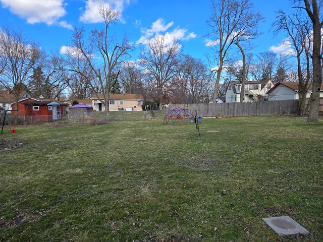 a backyard of a house with lots of green space