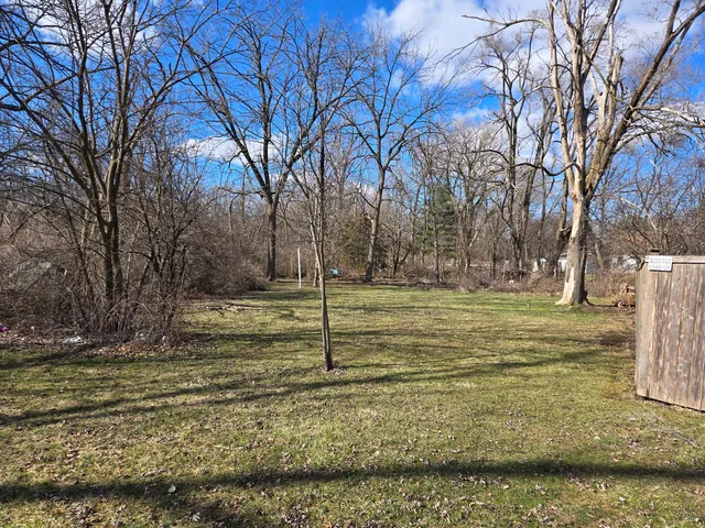 a view of a yard with an trees
