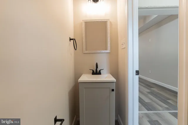 a bathroom with a sink and mirror