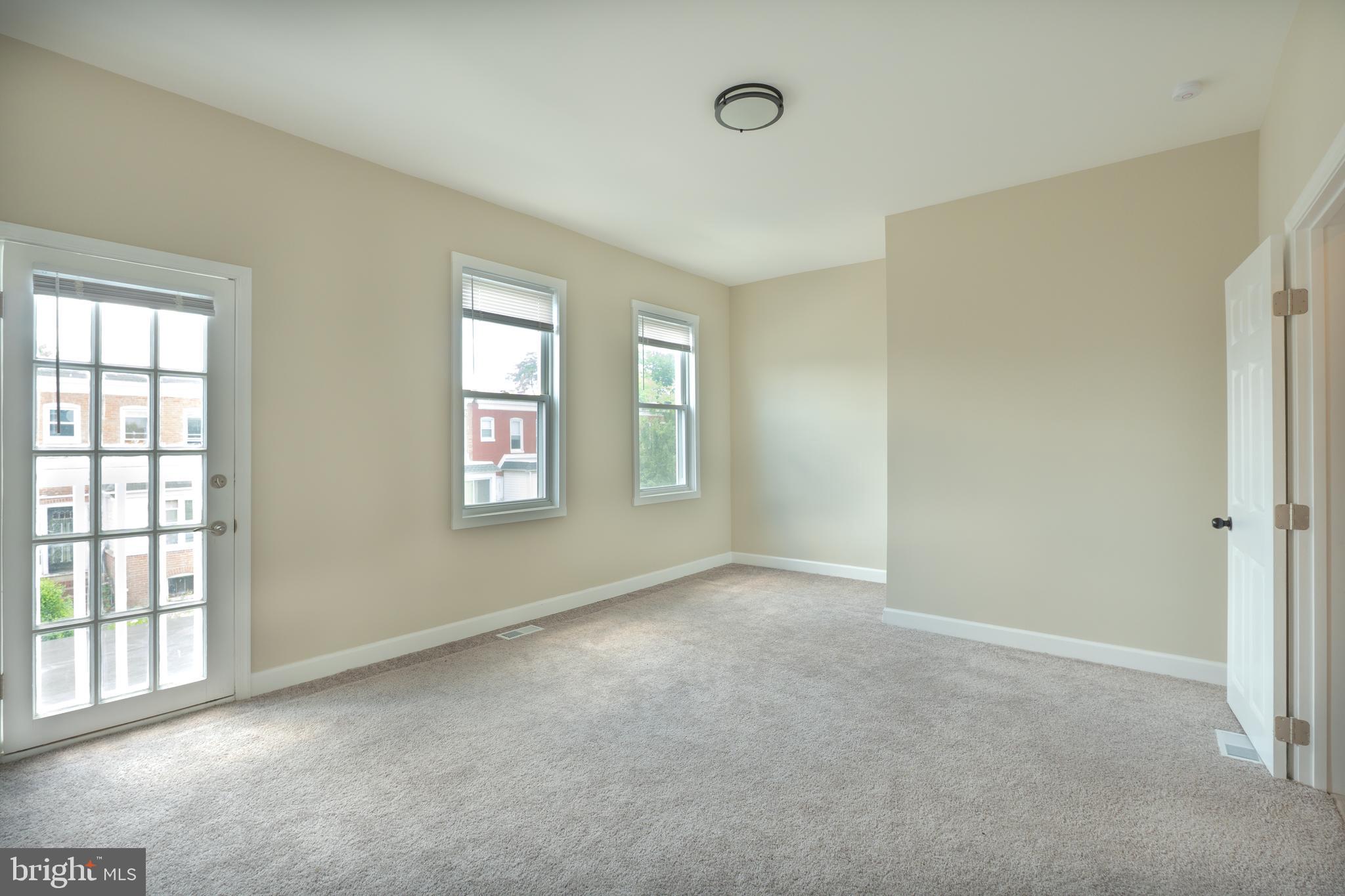 2808 Waldorf Avenue Baltimore, MD 21215 - Photo 19 of 26 an empty room with windows