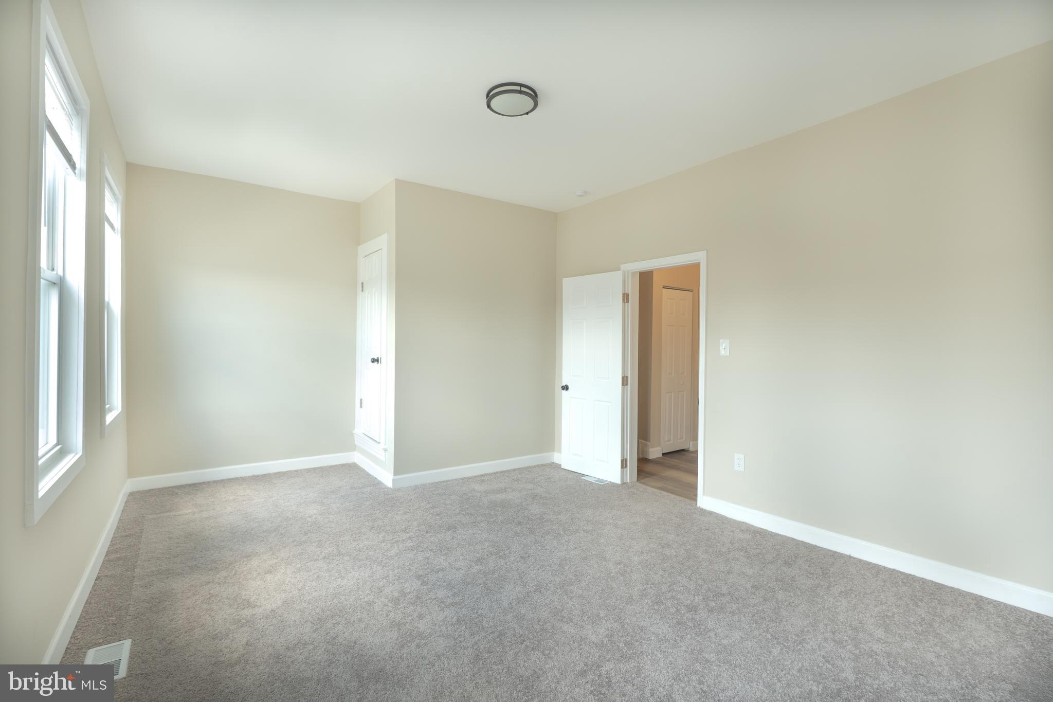 2808 Waldorf Avenue Baltimore, MD 21215 - Photo 20 of 26 a view of an empty room with a window