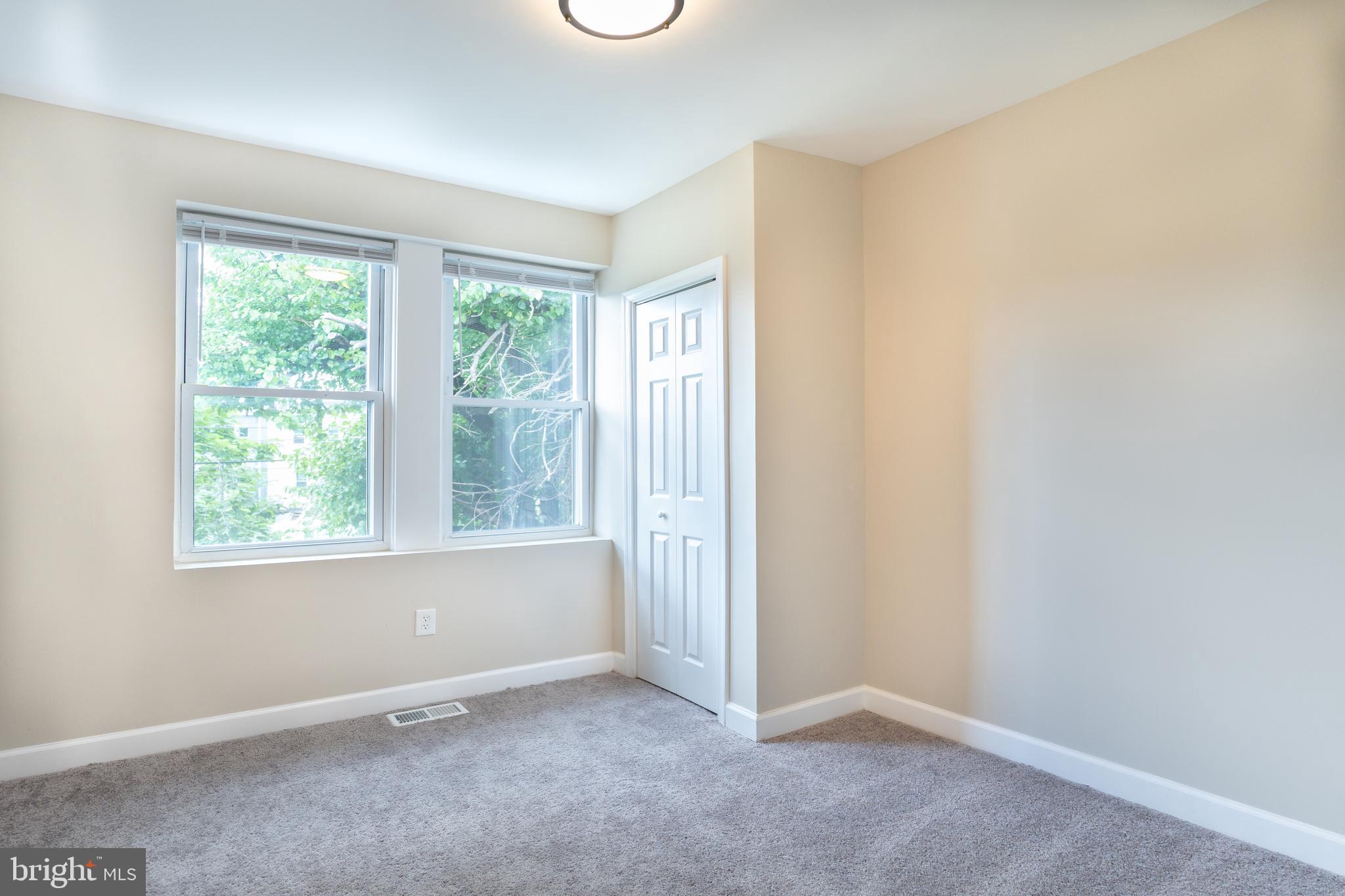 2808 Waldorf Avenue Baltimore, MD 21215 - Photo 24 of 26 an empty room with windows
