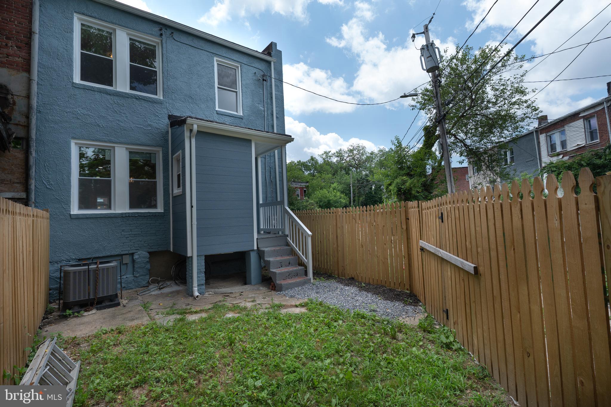 2808 Waldorf Avenue Baltimore, MD 21215 - Photo 26 of 26 a view of backyard with barbeque grill and wooden fence