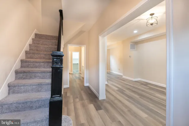 a view of entryway with wooden floor