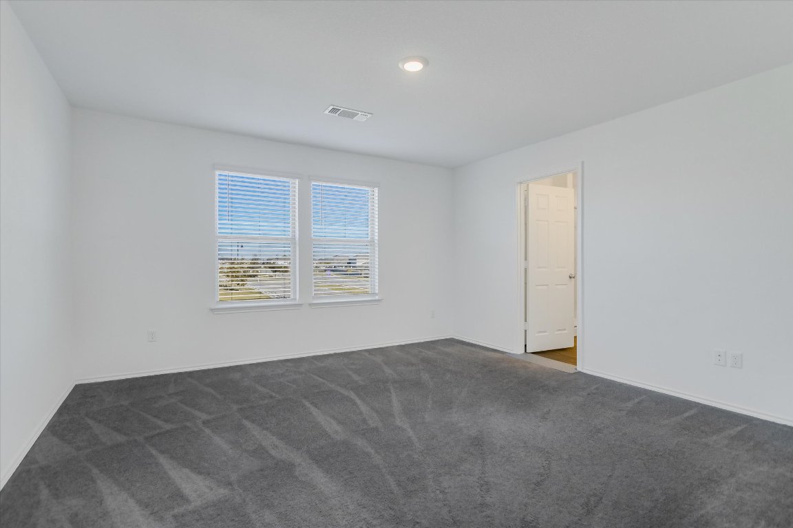 661 Pickrell Loop Georgetown, TX 78628 - Photo 13 of 27 a view of an empty room with a window