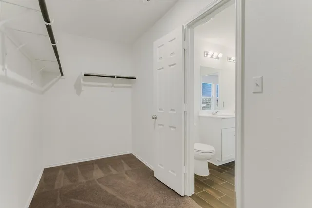 a bathroom with a double vanity sink a mirror and a shower