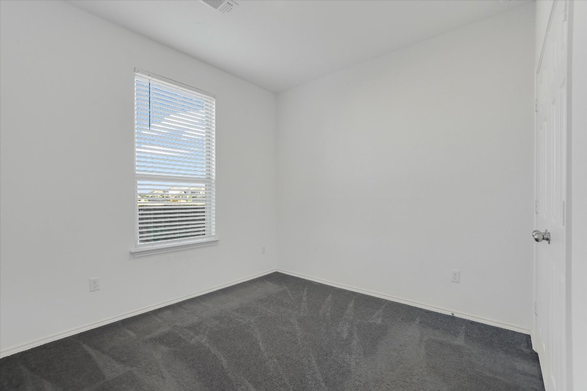 661 Pickrell Loop Georgetown, TX 78628 - Photo 17 of 27 a view of an empty room with a window