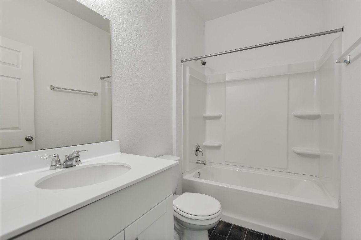 661 Pickrell Loop Georgetown, TX 78628 - Photo 18 of 27 a bathroom with a sink toilet and shower