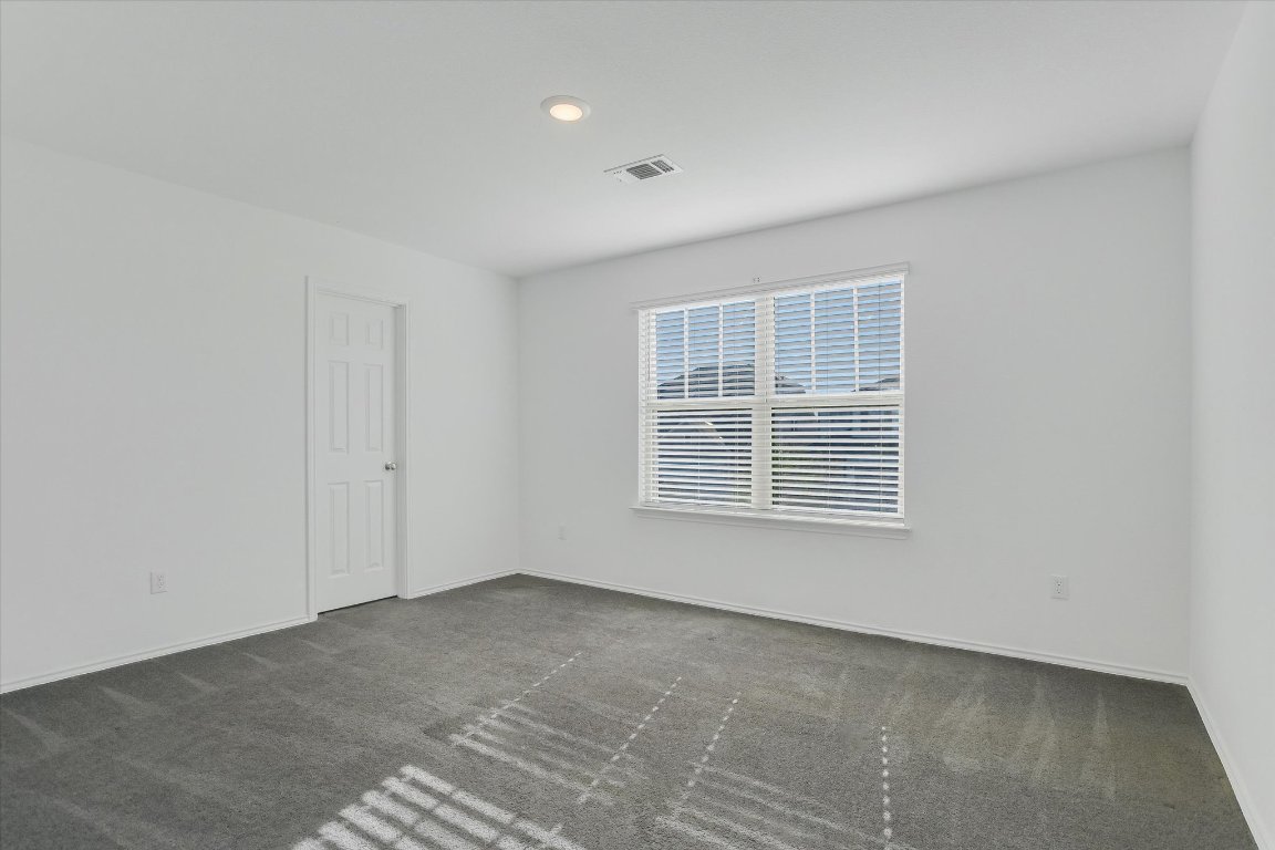661 Pickrell Loop Georgetown, TX 78628 - Photo 19 of 27 a view of an empty room with a window