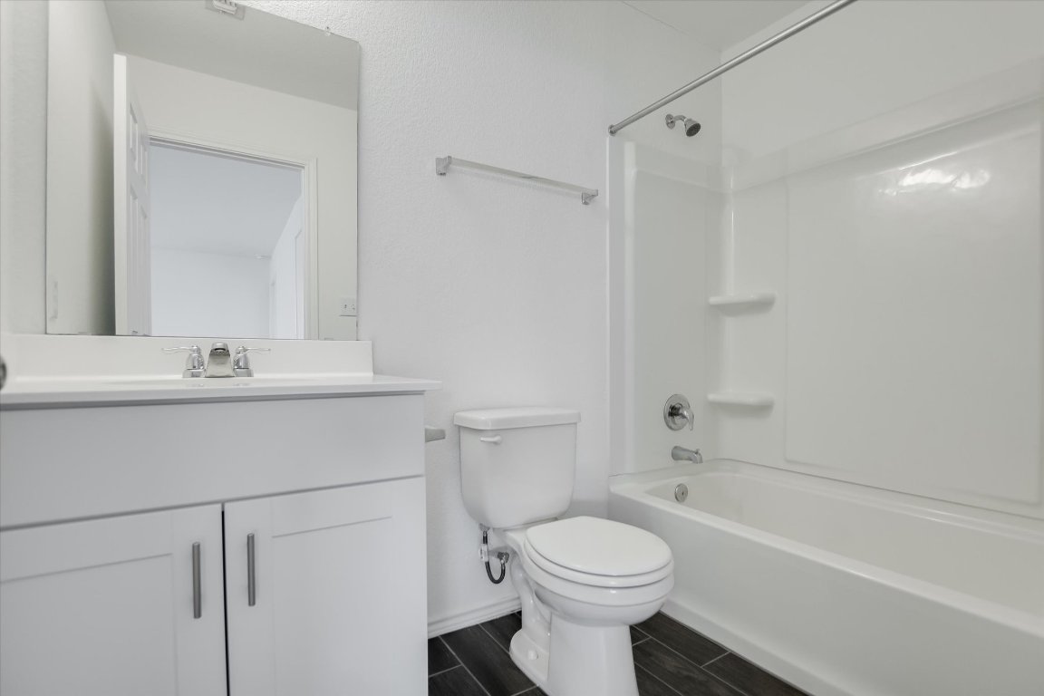 661 Pickrell Loop Georgetown, TX 78628 - Photo 20 of 27 a bathroom with a sink toilet and shower