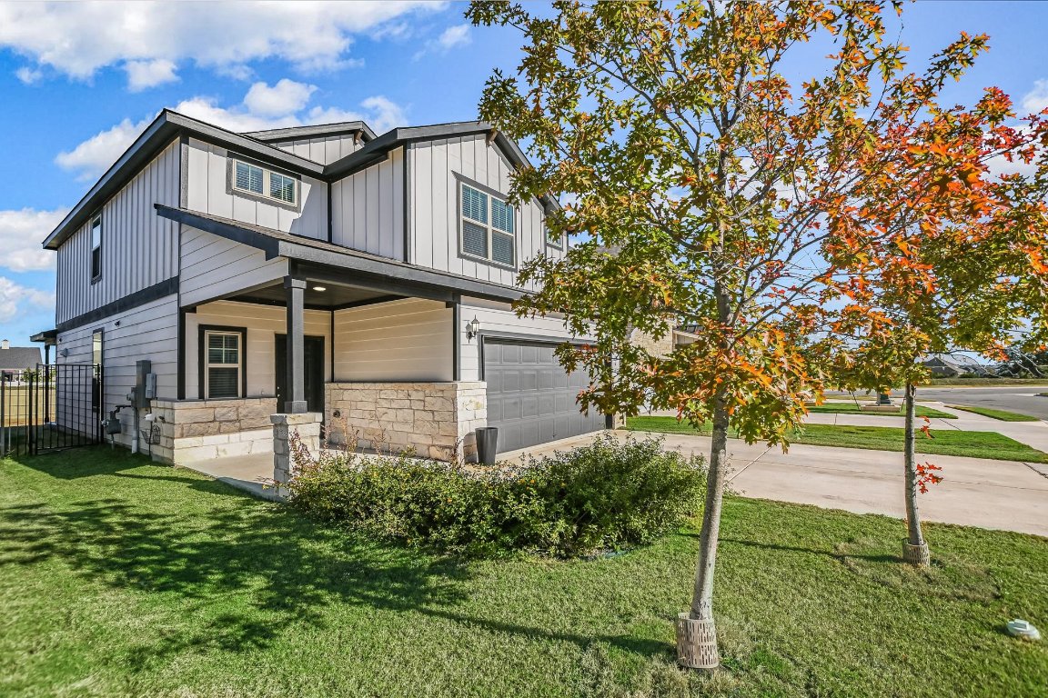 661 Pickrell Loop Georgetown, TX 78628 - Photo 2 of 27 a house that has a tree in front of it