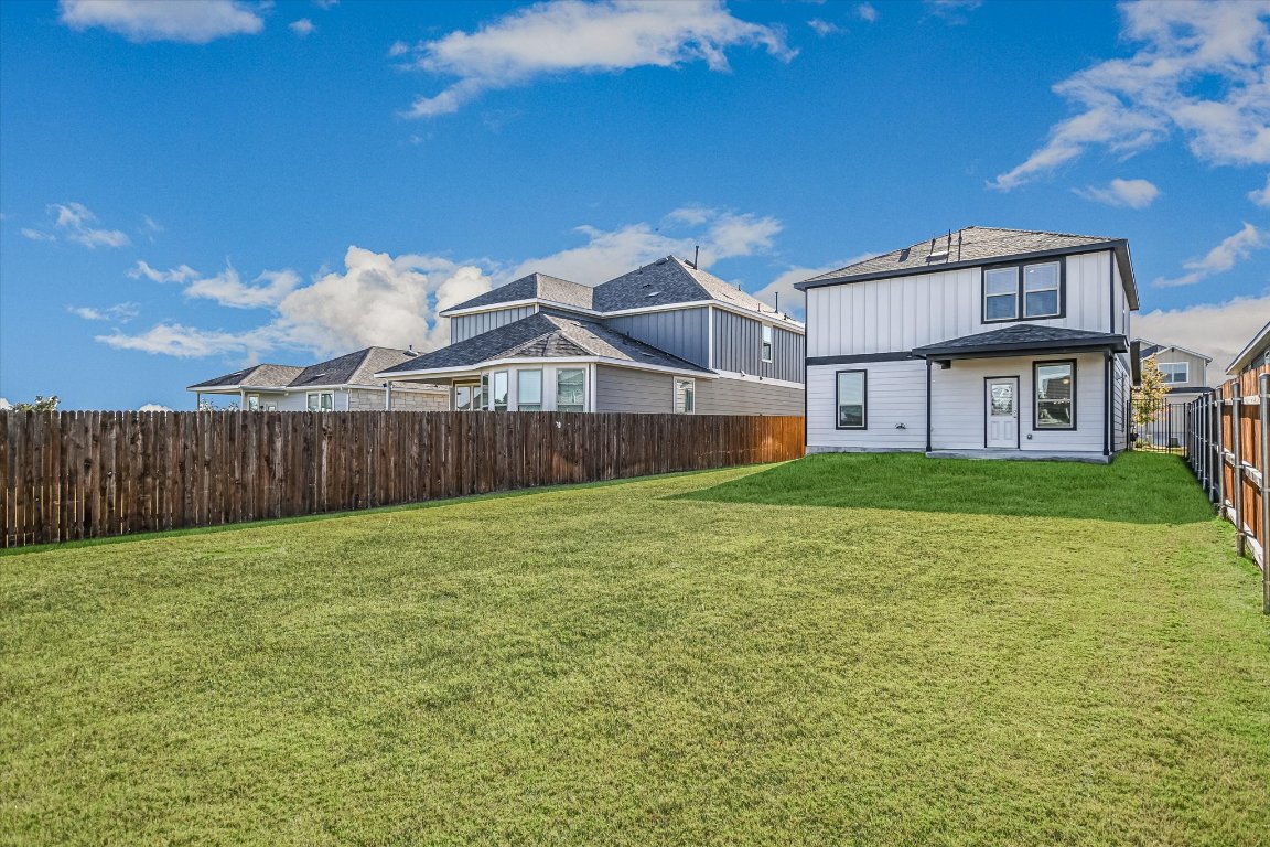 661 Pickrell Loop Georgetown, TX 78628 - Photo 24 of 27 a house view with a garden space