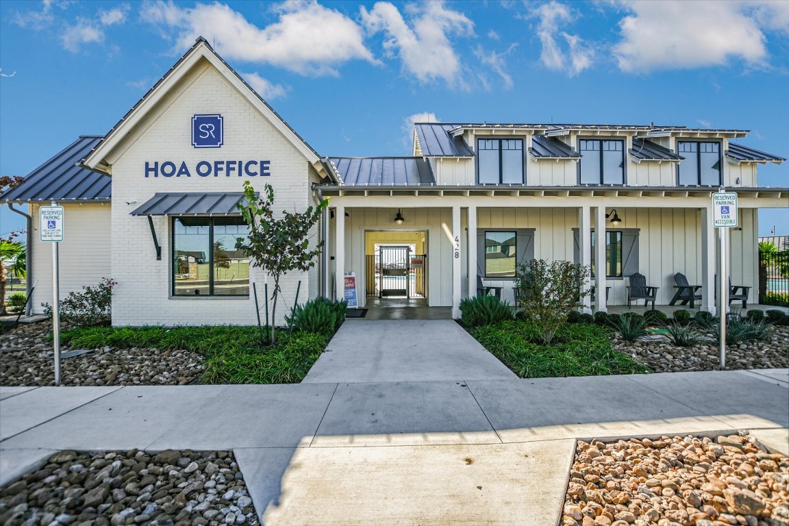 661 Pickrell Loop Georgetown, TX 78628 - Photo 25 of 27 a front view of a house with a yard