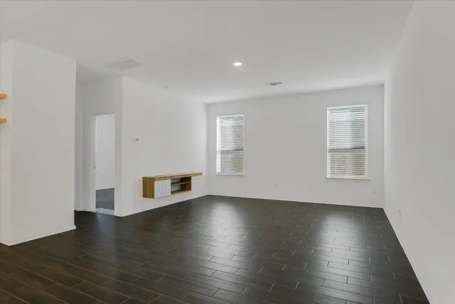 a view of a livingroom with wooden floor