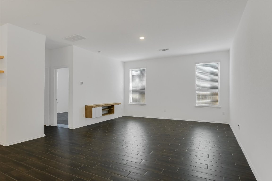661 Pickrell Loop Georgetown, TX 78628 - Photo 5 of 27 a view of a livingroom with wooden floor