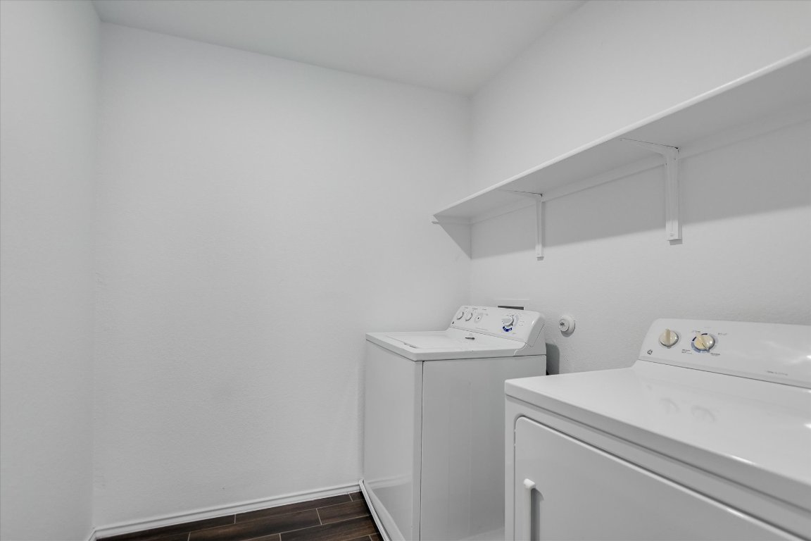 661 Pickrell Loop Georgetown, TX 78628 - Photo 10 of 27 a utility room with dryer and washer