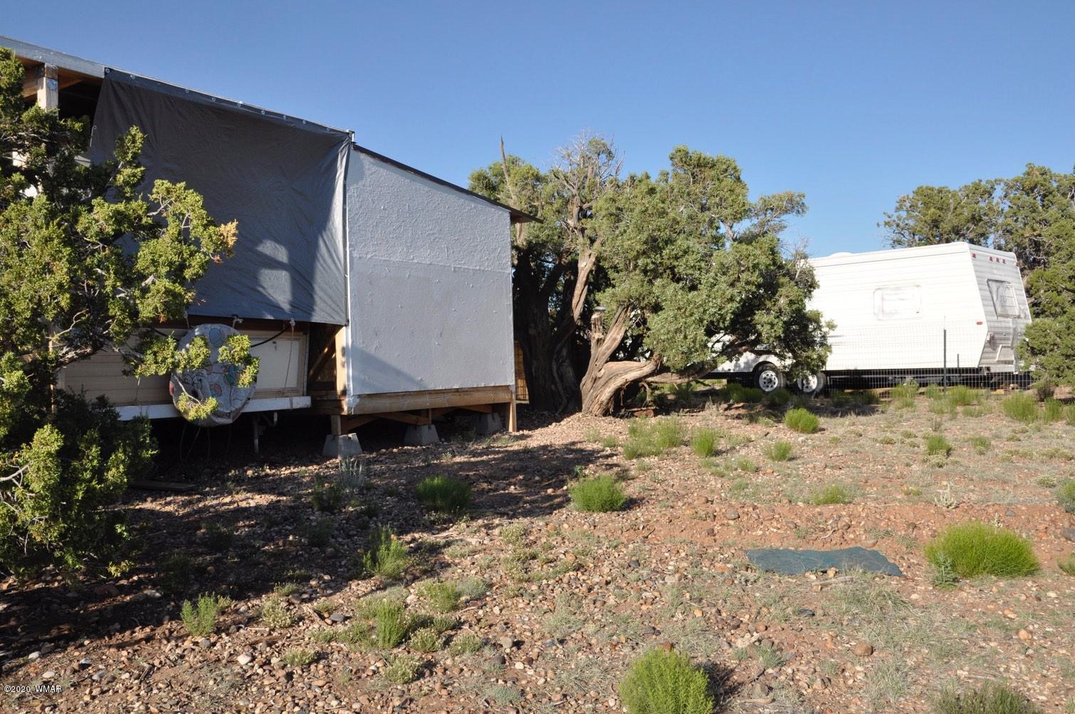 4241 Colt Road Snowflake, AZ 85937 - Photo 20 of 28 a view of a house with a yard and a garden
