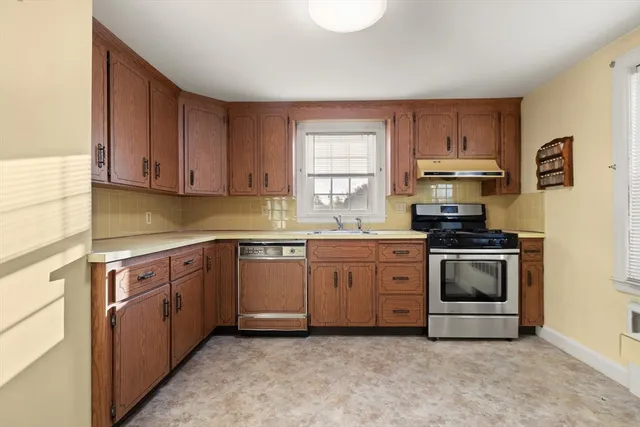 a kitchen with sink and cabinets