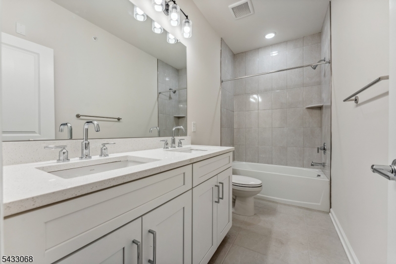 3 Sternadori Road Somerville, NJ 08876 - Photo 19 of 22 a bathroom with a double vanity sink toilet mirror and bathtub