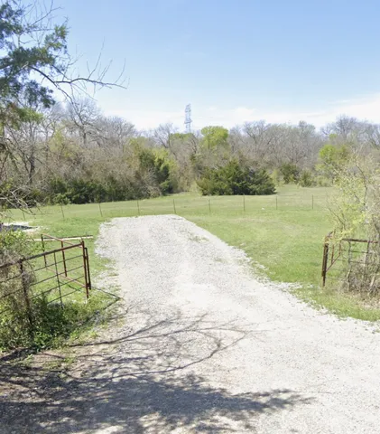 a view of a lake with a big yard