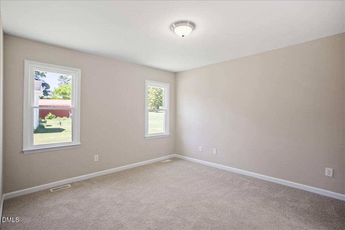 31 Fieldview Court Angier, NC 27501 - Photo 12 of 25 an empty room with windows