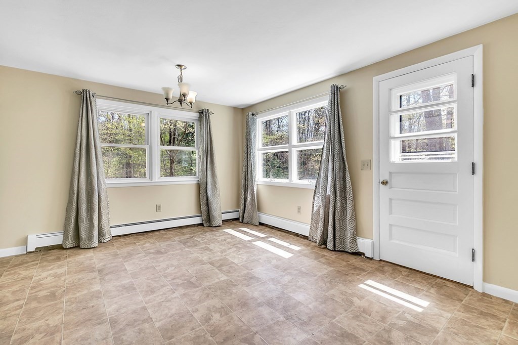 34 1/2 Paradise Lake Road Monson, MA 01057 - Photo 13 of 30 an empty room with windows and entryway