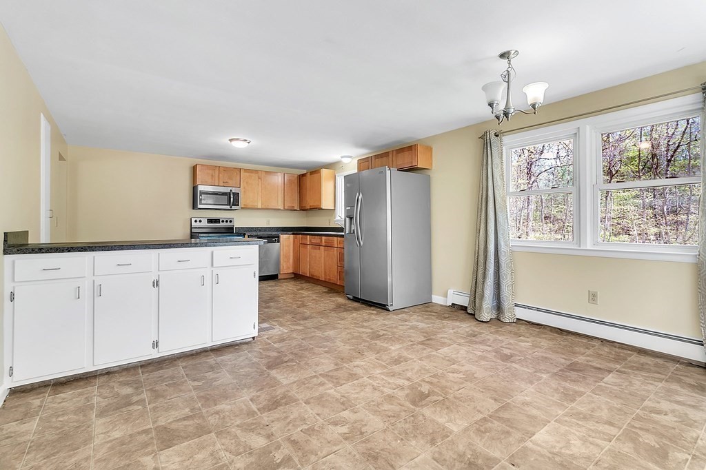 34 1/2 Paradise Lake Road Monson, MA 01057 - Photo 14 of 30 a view of kitchen with granite countertop cabinets and window
