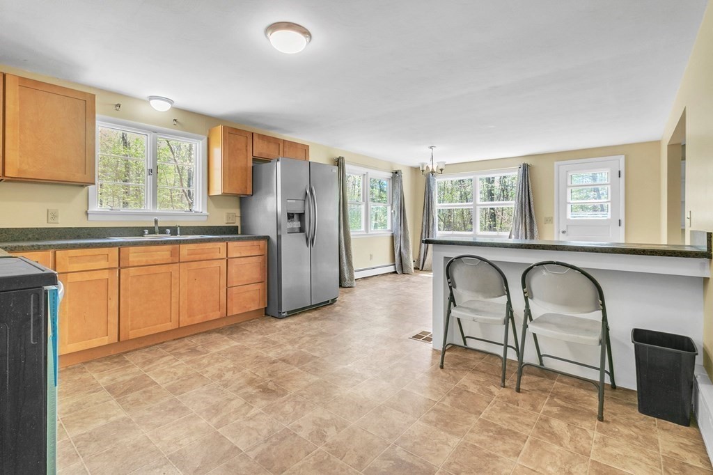 34 1/2 Paradise Lake Road Monson, MA 01057 - Photo 17 of 30 a living room with furniture and a large window