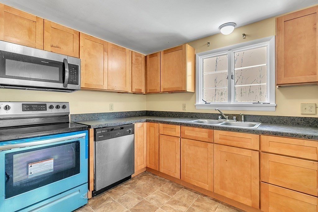 34 1/2 Paradise Lake Road Monson, MA 01057 - Photo 18 of 30 a kitchen with granite countertop cabinets stainless steel appliances and a sink