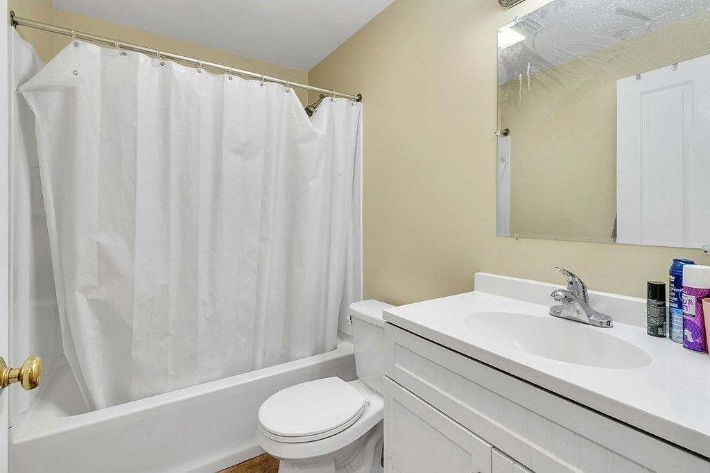 34 1/2 Paradise Lake Road Monson, MA 01057 - Photo 19 of 30 a white toilet sitting next to a bathroom sink