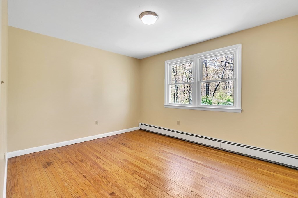 34 1/2 Paradise Lake Road Monson, MA 01057 - Photo 22 of 30 a view of empty room with wooden floor and fan