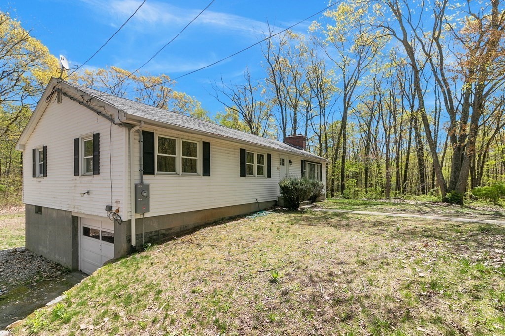 34 1/2 Paradise Lake Road Monson, MA 01057 - Photo 6 of 30 a view of a house with a yard